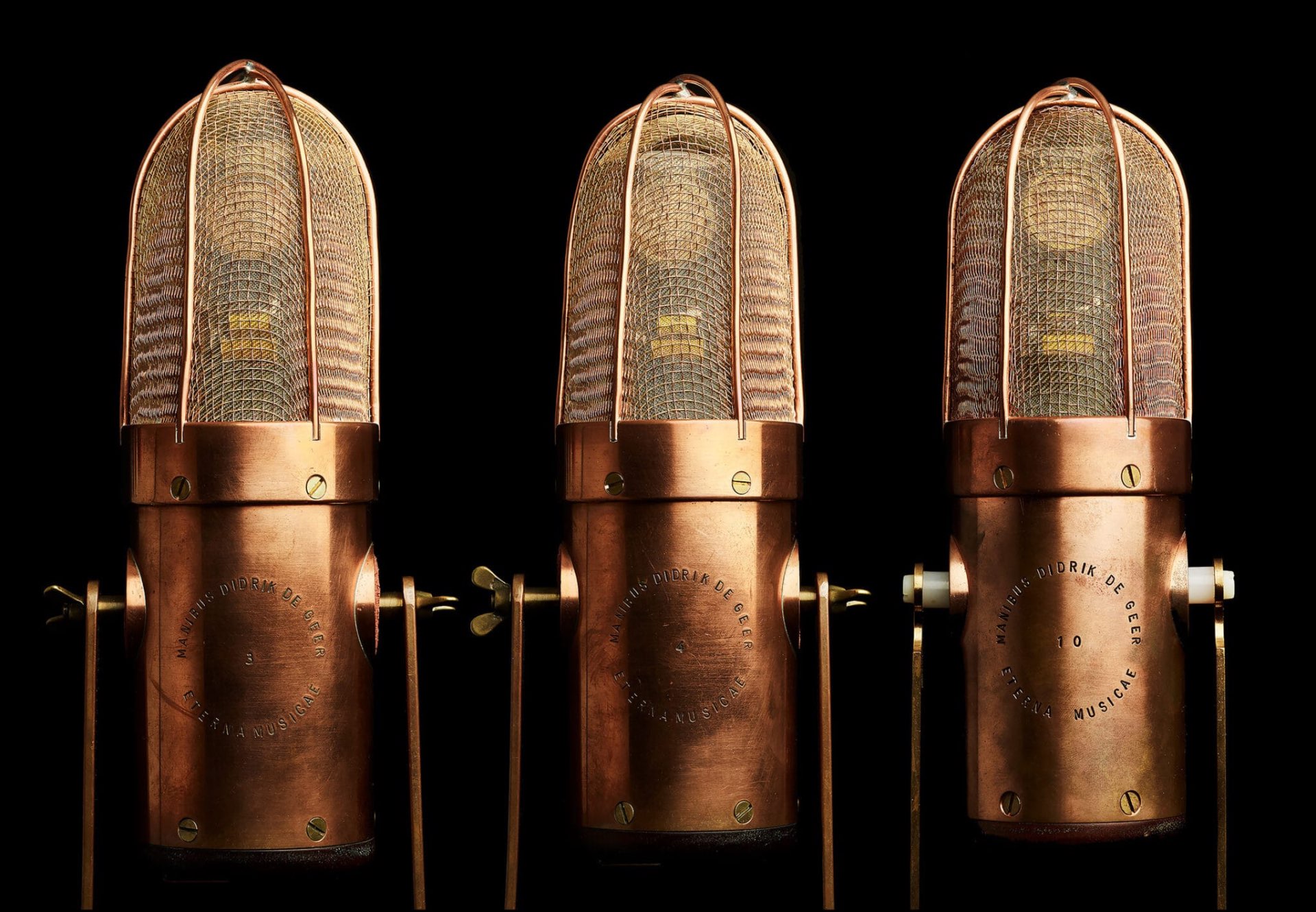 Three handcrafted Didrik De Geer microphones in polished copper housings